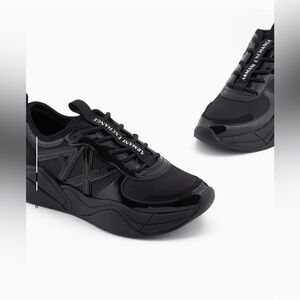 Armani Exchange women’s Glossy Black Sneakers